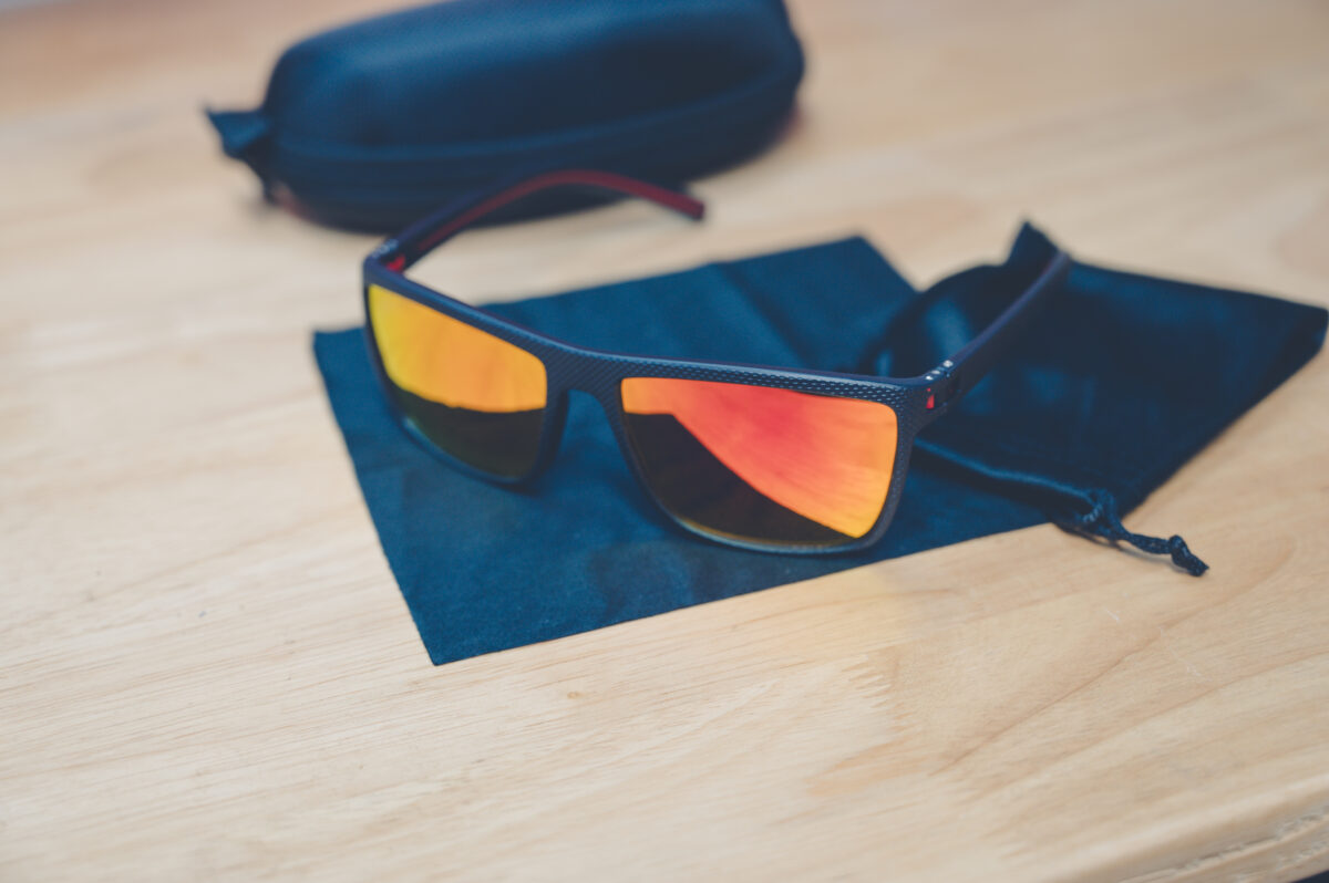 Cross Vision Sunglasses with black frames and red lenses, faith-based accessory