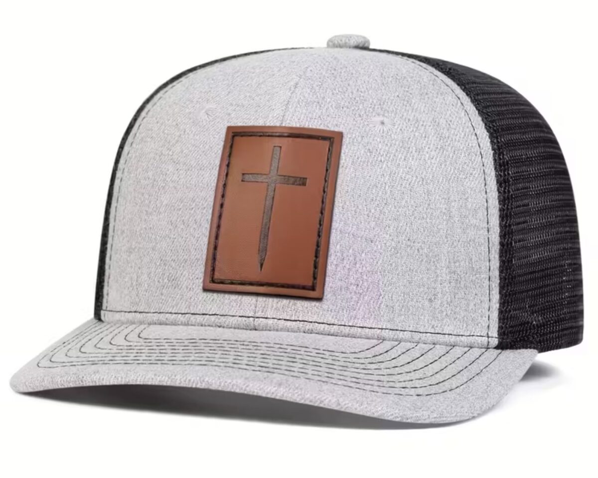 Cross Patch Trucker Hat with brown leather cross, heather grey front, black mesh back